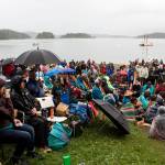 A crowd of hundreds don raincoats as they listen to the welcoming ceremony of the Moananuiākea voyage and Hōkūlea which arrived at Auke Bay Saturday afternoon. (Mark Sabbatini / Juneau Empire)