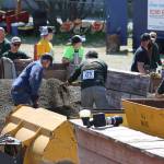 Volunteers reset a gravel pile during the mens hand mucking event of Juneau Gold Rush Days in Savikko Park on June 18, 2022. This years events are scheduled Saturday and Sunday. (Michael S. Lockett / Juneau Empire File)