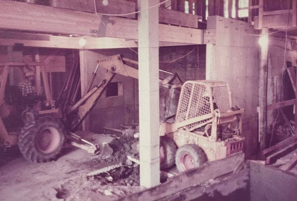 Heavy equipment fills the ground floor of the Senate Building in 1983-84 when Larry Spencer and Bruce Denton remodeled old apartments into modern retail and office spaces. The building lot was once several small structures, including Juneau Iron Works during the towns early mining days. (Photo courtesy Bruce Denton)