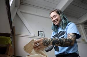 Chloey Cavanaugh, owner of Black and White Raven Co., folds a shirt at her downtown studio Monday morning. Cavanaughs company is an LGBTQ+ and Indigenous small business based in Juneau. (Clarise Larson / Juneau Empire)