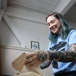 Chloey Cavanaugh, owner of Black and White Raven Co., folds a shirt at her downtown studio Monday morning. Cavanaughs company is an LGBTQ+ and Indigenous small business based in Juneau. (Clarise Larson / Juneau Empire)