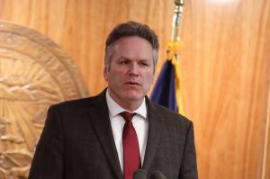 Gov. Mike Dunleavy speaks during a news conference in April focusing on the budget and a long-range fiscal plan for the state. He signed the budget for the fiscal year starting July 1 on Sunday, but did not publicly announce the signing or line-item vetoes made  including cutting in half an increase to public education spending  until Monday. (Clarise Larson / Juneau Empire File)