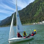 Jack Adams, 15, Lua Mangaccat, 15, and Sigrid Eller, 13, enjoy calm waters in Gastineau Channel during a Juneau Youth Sailing course this week. (Photo by Adrian Whitney)