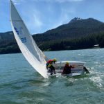 Lua Mangaccat, 15, and Jack Adams, 15, try right their boat during a Juneau Youth Sailing course this week. (Photo by Adrian Whitney)