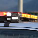 Emergency lights flash on top of a police car. (Ben Hohenstatt / Juneau Empire File)