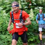 Dan Rondeau, 69, descends a trail during the Juneau Ridge Race on Sunday. (Mark Sabbatini / Juneau Empire)