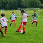 Members of the Juneau Soccer Clubs 2013 Boys team, wearing white and red jerseys, compete in the Starfire Spring Classic soccer tournament in Seattle earlier this month. Five teams with the local club took part in the three-day competition from June 16-18. (Photo courtesy of Juneau Soccer Club)