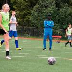Moctar Diouf (center), director of coaching for the Juneau Soccer Club, watches participants practice Monday at Adair-Kennedy Memorial Park. (Therese Pokorney / Juneau Empire)