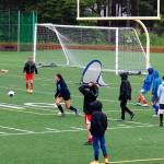 Juneau Soccer Club participants practice in the rain Monday at Adair-Kennedy Memorial Park. (Therese Pokorney / Juneau Empire)