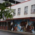 People walk past City Hall downtown on Monday evening. The City and Borough of Juneau Assembly passed an ordinance Monday night to allow the city to advocate for a new City Hall ahead of the upcoming municipal election. (Clarise Larson / Juneau Empire)