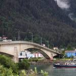 A boat crosses under the bridge between the Juneau mainland and Douglas Island on Wednesday morning. (Clarise Larson / Juneau Empire)