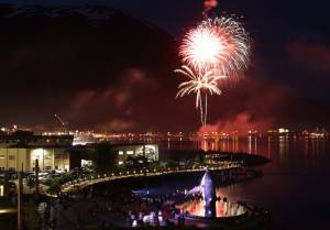 Fireworks boom above Tahku the whale sculpture and downtown during the annual Fourth of July firework display over Gastineau Channel. (Clarise Larson / Juneau Empire)