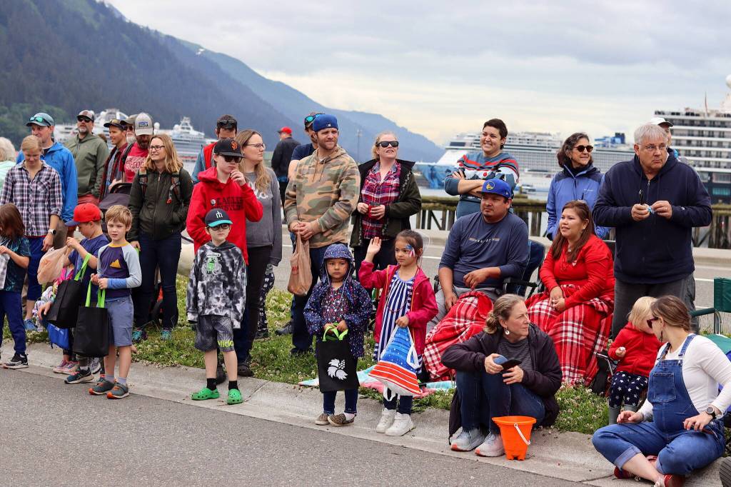 Kids await candy and other items being thrown from floats during the Fourth of July parade through downtown Juneau on Tuesday. (Mark Sabbatini / Juneau Empire)