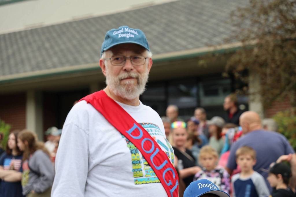 Douglas Parade grand marshal Ed Schoenfeld smiles Tuesday afternoon during the annual Fourth of July parade in Douglas. (Clarise Larson / Juneau Empire)