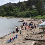 Dozens of residents gather on Sandy Beach for the annual sandcastle challenge Tuesday afternoon in Douglas. (Clarise Larson / Juneau Empire)