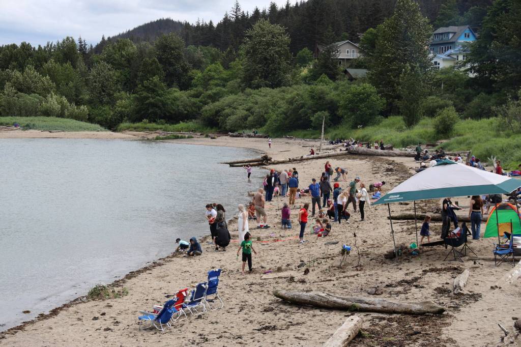 Dozens of residents gather on Sandy Beach for the annual sandcastle challenge Tuesday afternoon in Douglas. (Clarise Larson / Juneau Empire)