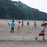 Children pick up sand dollars on Sandy Beach on July 3. The end of this week is expected to be ideal beach weather with near-record temperatures forecast in Juneau and elsewhere in Southeast Alaska. (Therese Pokorney / Juneau Empire File)