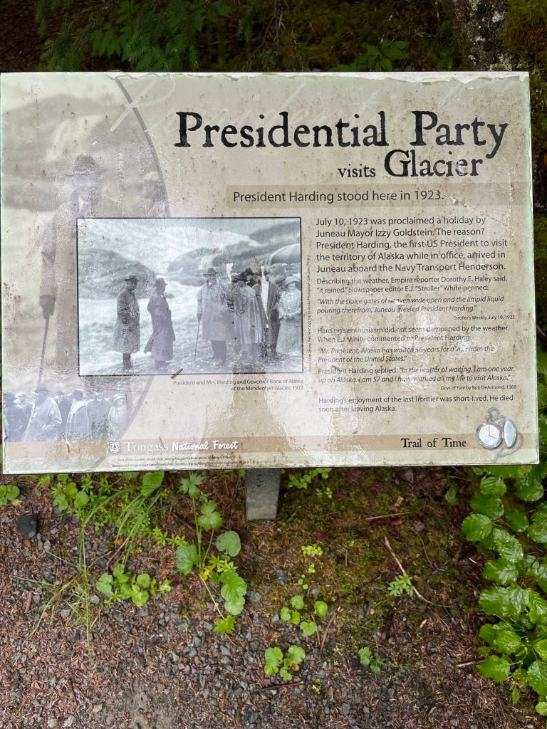 The U.S. Forest Service has erected a series of interpretive signs along the Trail of Time at Mendenhall Glacier. This sign is one of many detailing significant events measured by the glaciers retreat. Today the terminus is more than 1.5 miles from this spot where President Warren G. Harding stood in 1923. (Photo by Laurie Craig)
