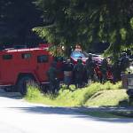 Andre P. Lawrence is detained by police officers at a residence on Riverwood Drive on Friday morning. He was later arrested in connection with the fatal shooting of a 23-year-old man on Cinema Drive on Thursday evening. (Clarise Larson / Juneau Empire)