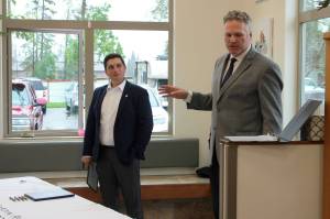 Gov. Mike Dunleavy (right) delivers opening remarks at a bill signing event at Twin Cities Veterinary Clinic on Thursday in Soldotna. (Ashlyn OHara/Peninsula Clarion)
