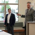 Gov. Mike Dunleavy (right) delivers opening remarks at a bill signing event at Twin Cities Veterinary Clinic on Thursday in Soldotna. (Ashlyn OHara/Peninsula Clarion)