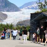 A crowd of visitors tours the Mendenhall Glacier on Friday. Officials announced Friday limits on commercial tours are being imposed as capacity limits are being rapidly reached, which will impact the second half of the summer tourism season. A plan by the U.S. Forest Service to overhaul the facilities of the Mendenhall Glacier Recreation Area is now in the final stage, which would replace the existing capacity limits with newly defined management practices. (Clarise Larson / Juneau Empire)