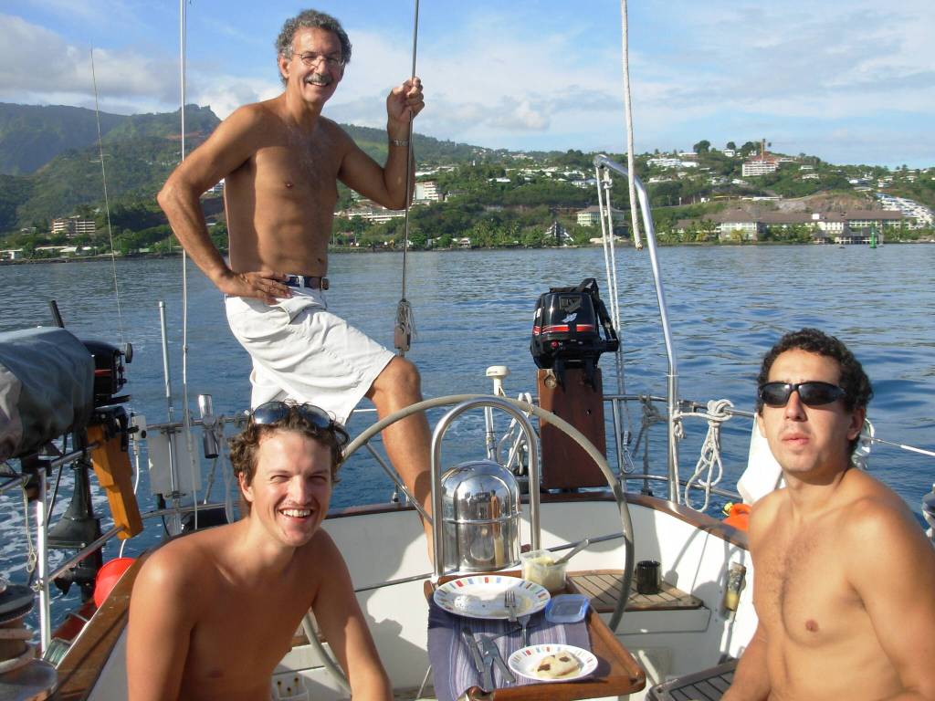 William Bill Heumann, center, and crew members of the Second Wind depart Galapagos for Marquessas in 2008. (Photo courtesy of William Heumann)
