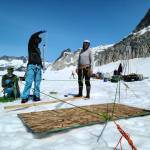 Scientists Jake Shaffer and Jared Clance, along with field mountaineer Brian Muller, collect water samples from an air-water interface on the Juneau Icefield earlier this month. Researchers are studying the bottom of the water table at bedrock  272 meters down  and doing a biochemical analysis for elements such as major ions, dissolved organic carbon and biomolecules. Such data may provide links about connections between the top and bottom of the water table. (Photo courtesy of Jacob Holmes)