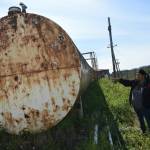 Petty Officer 3rd Class Brandon Dawson, a Coast Guard Marine Safety Task Force member from Coast Guard Sector Anchorage, chats with a representative at a fuel facility in St. Michael, Alaska, during an inspection July 28, 2022. Teams comprised of six Coast Guard marine inspectors visited a total of 15 communities and inspected approximately 55 bulk fuel storage facilities in the Bering Strait Region July 25-Aug. 2, 2022. (U.S. Coast Guard photo by Petty Officer 1st Class Nate Littlejohn)