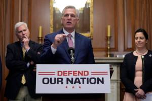 House Speaker Kevin McCarthy of Calif., speaks during a news conference after the House approved an annual defense bill, Friday, July 14, 2023, on Capitol Hill in Washington. Standing behind McCarthy are House Majority Whip Tom Emmer, R-Minn., left, and House Republican Conference Chair Elise Stefanik, R-N.Y. (AP Photo/Patrick Semansky)