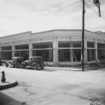 Looking into the 1930s AELP building under construction with a patient dog waiting on the corner. A copy of this photo has an honored place inside Amalga Distillery. Taken September 10, 1936 by Delano. (Photo courtesy AELP)