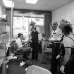 Then-managing editor of the Juneau Empire Carl Sampson (seated left) holds a warrant for his arrest by the Juneau Slammer, a fundraiser on June 22, 1984. The Empire was located in the AELP building with its entrance on Second Street during the 1980s. (Photo by Brian Wallace)