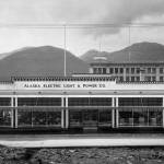 The Franklin Street view of AELPs 1930s building reveals its Art Deco architectural style, characterized by geometric features. The power companys name is recessed in cast concrete. N. Lester Troast Co. designed the building which R. J. Somers constructed. The five-story Goldstein Emporium rises in the background with Douglas Island hills beyond. (Photo courtesy AELP)