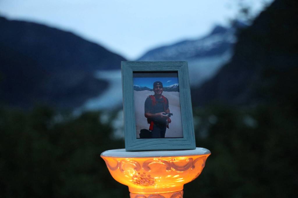A candlelit vigil was held at the Mendenhall Glacier Visitor Center to honor Paul Rodriguez Jr., pictured, who drowned while kayaking on Mendenhall Lake last week. (Clarise Larson / Juneau Empire)