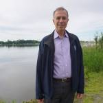 Dimitri Kusnezov, the U.S. Department of Homeland Securitys undersecretary for science and technology, stands by Lake Spenard on Tuesday. Kusnezov was on his first Alaska trip, with stops from Juneau to Utqiagvik. (Photo by Yereth Rosen/Alaska Beacon)