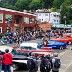 More than 100 residents, tourists and other observers line Ferry Way to watch Alaska Fashion Weeks outdoor runway show in downtown Juneau on Saturday. (Mark Sabbatini / Juneau Empire)