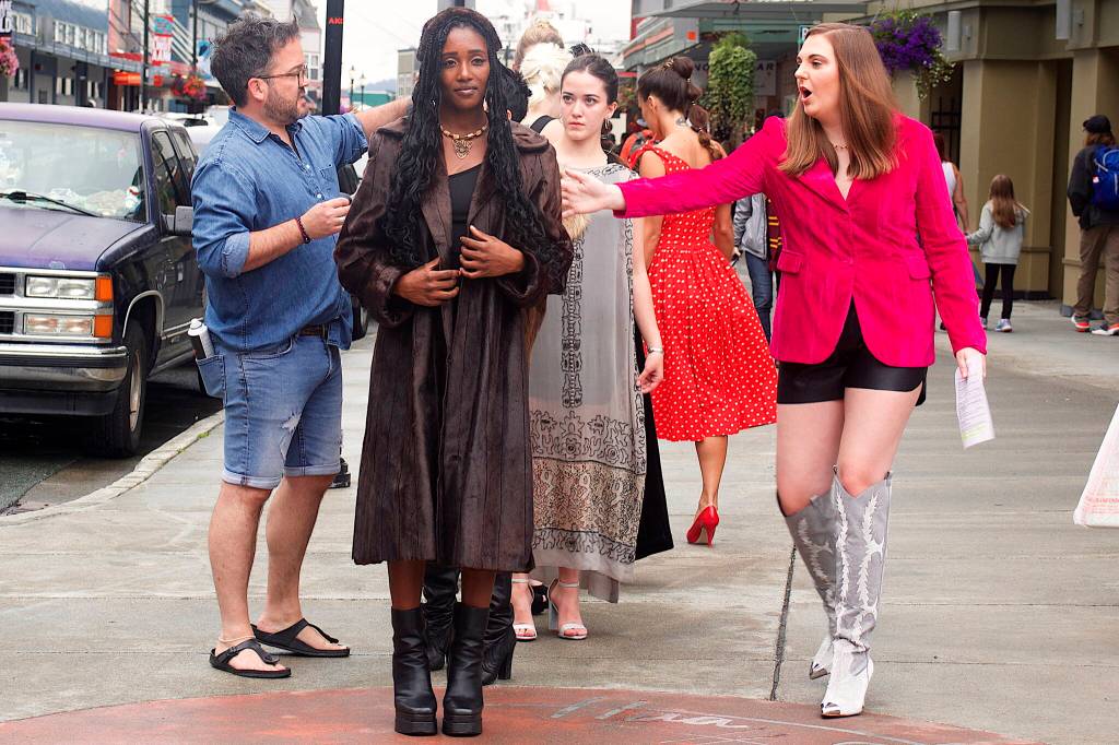 Models prepare to walk the length of Ferry Street during Alaska Fashion Weeks outdoor runway show in downtown Juneau on Saturday. (Mark Sabbatini / Juneau Empire)