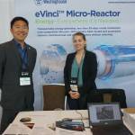 Michael Valore, senior director of advanced reactors energy systems, and Danielle Kline, test engineer, stand at a booth promoting Westinghouses microreactor technology at an Anchorage conference in 2022. Westinghouse plans to bid on a contract to build a nuclear microreactor at Eielson Air Force Base. (Photo by Yereth Rosen/Alaska Beacon)
