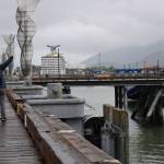 Visitors take a selfie on the downtown cruise ship docks in July. (Clarise Larson / Juneau Empire File)