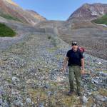 Ned Rozell walks on Fireweed rock glacier near McCarthy this month. (Photo by Adam Bucki)