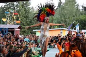 Juneau Drag performer and event emcee Gigi Monroe struts the runway in front of hundreds gathered at the main stage of the Southeast Alaska State Fair in Haines on Friday evening for the performance groups debut show at the fair. (Clarise Larson / Juneau Empire)