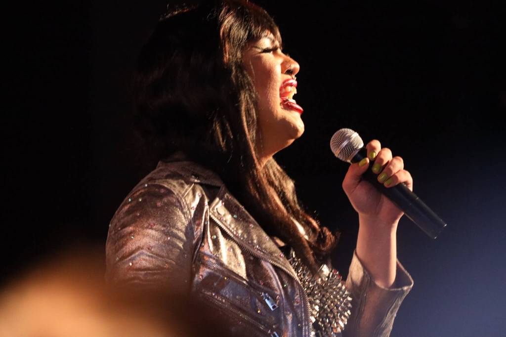 Yasmine Mazon sings to the hundreds of audience members with a performance at the main stage of the Southeast Alaska State Fair in Haines on Friday evening for the performance groups debut show at the fair. (Clarise Larson / Juneau Empire)