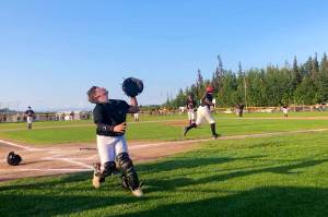 Juneau catcher Isaac Kirsch looks to catch a pop-up foul against Dimond West in the deciding fifth game of the Alaska Little League Majors Baseball State Tournament in Anchorage. (Screenshot from Gastineau Channel Little League video of game)