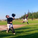 Juneau catcher Isaac Kirsch looks to catch a pop-up foul against Dimond West in the deciding fifth game of the Alaska Little League Majors Baseball State Tournament in Anchorage. (Screenshot from Gastineau Channel Little League video of game)