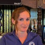 Tending bar is just one of the jobs Amber Geil does as a steward on the Columbia. She also rings up customers in the dining room and cleans staterooms. We all take on multiple jobs, she said. (Meredith Jordan / Juneau Empire)