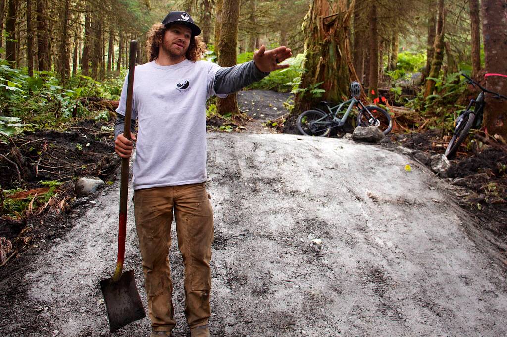 Gary Paasch, owner of a professional mountain bike trail-building company in based in Washington state, explains Saturday how a route was selected through second-growth forest for the intermediate-level trail for the new Thunder Mountain Bike Park on Saturday. (Mark Sabbatini / Juneau Empire)