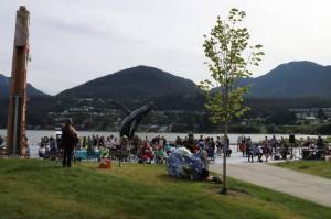 Marian Call and Conor Lendrum perform a song during the annual Climate Fair for a Cooler Planet on Saturday afternoon at Overstreet Park. (Meredith Jordan / Juneau Empire)