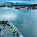 Members of the deck department of the Columbia state ferry get ready to dock the vessel in Petersburg on July 17. A change in the accounting department is expected to lessen the number of payroll complaints among Alaska Marine Highway System employees. (Meredith Jordan / Juneau Empire)