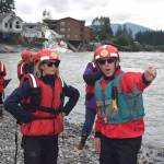 U.S. Sen. Lisa Murkowski (left) views the Mendenhall River on Tuesday as Juneau Assembly member Wade Bryson explains changes that occurred to the riverbank due to record flooding from Suicide Basin last Saturday. Juneau state representatives Sara Hannan and Andi Story were among the other officials taking part in the trip. (Tom Mattice / City and Borough Of Juneau)