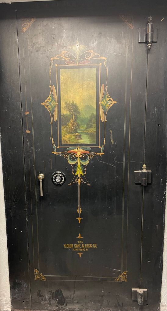 Scenic painting and decorative design on the original bank vault in the basement of Behrends Bank/Foggy Mountain Shop. (Photo by Laurie Craig)